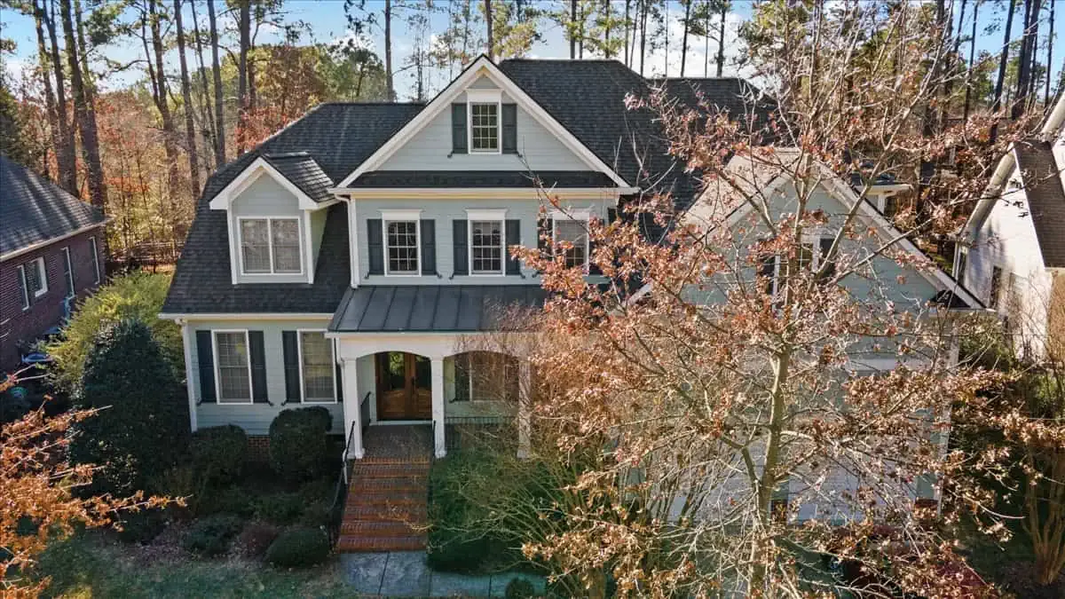 Brick exterior with fresh painted trim and shutters.